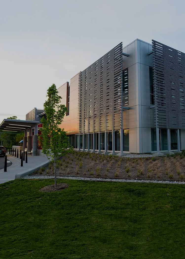 Metal roof manufacturer installing a metal roof on a building
